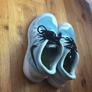 light blue Nike free runs 5.0